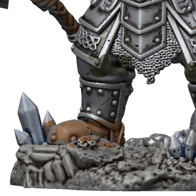 Close-up of the rock base with blue crystals and riveted boots